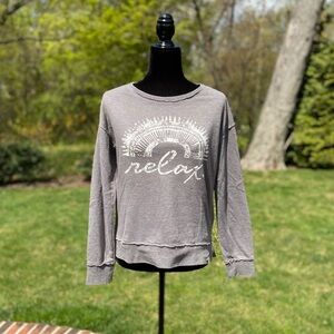 Women’s small Volcom sweater.